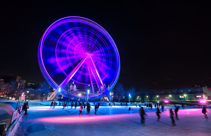 Pattinando ai piedi della ruota panoramica Grande Roue di Montréal