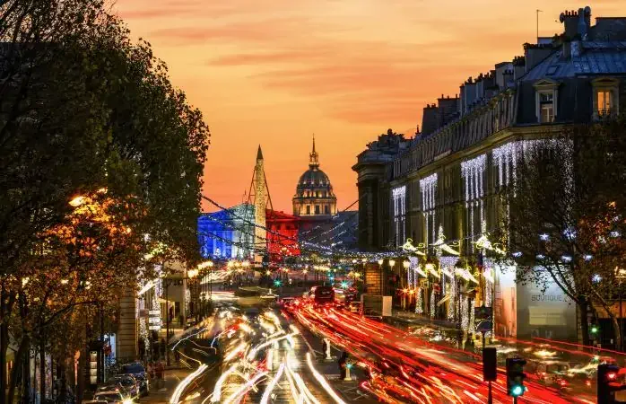 Royale Street and Concorde Plaza with Christmas lights. National Assembly (Palais Bourbon) colored in French Flag after terrorist attacks on Friday, November 13, 2015 in Paris. Cathedral 'Saint-Louis des Invalides', France