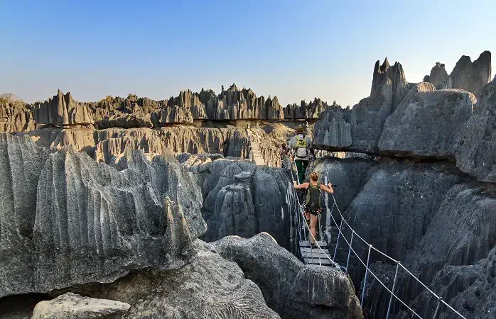 Beautiful tourist on an excursion in the unique limestone landscape at the Tsingy de Bemaraha Strict Nature Reserve in Madagascar